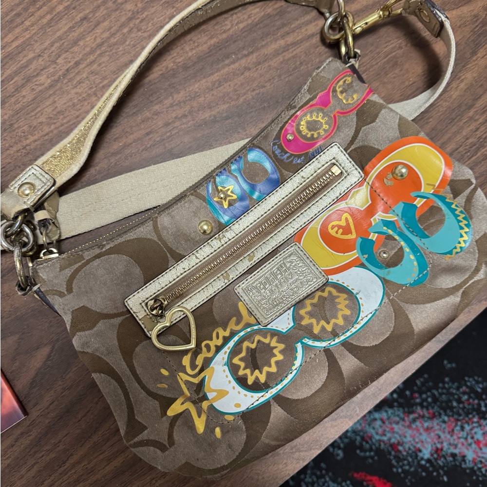 Coach Brown Shoulder Bag with Adjustable Strap and Structured Design